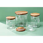 Alternate image 1 for Our Table&trade; 48 oz. Glass Canister with Acacia Lid