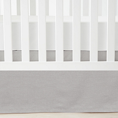 Lush Decor Printed Linen Textured Solid Crib Skirt in Grey. View a larger version of this product image.