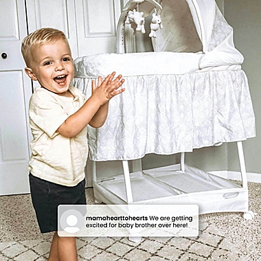 Simmons Kids Gliding Bedside Bassinet in White. View a larger version of this product image.