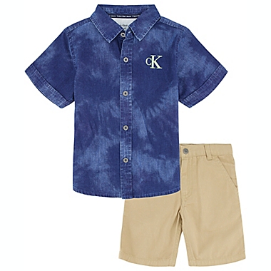 Calvin Klein&reg; 2-Piece Size 12M CK Logo Button Front Shirt and Short Set in Navy/Khaki. View a larger version of this product image.