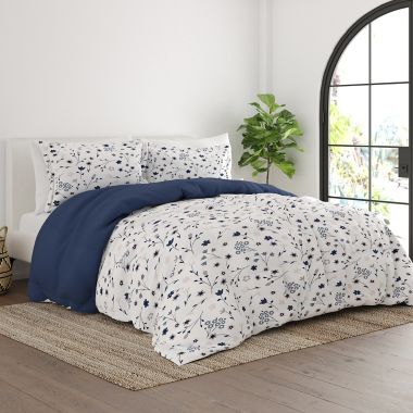 Home Collection&reg; Forget Me Not 3-Piece Reversible Full/Queen Comforter Set in Navy. View a larger version of this product image.
