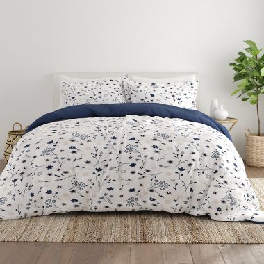 Home Collection&reg; Forget Me Not 3-Piece Reversible Full/Queen Comforter Set in Navy. View a larger version of this product image.