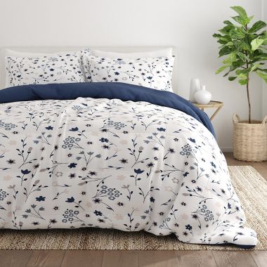 Home Collection&reg; Forget Me Not 3-Piece Reversible Full/Queen Comforter Set in Navy. View a larger version of this product image.