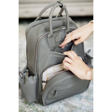 JuJuBe&reg; Million Pockets Faux Leather Deluxe Diaper Backpack in Earth Leather. View a larger version of this product image.