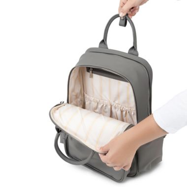 JuJuBe&reg; Million Pockets Faux Leather Deluxe Diaper Backpack in Earth Leather. View a larger version of this product image.