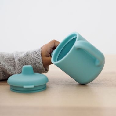 BEABA&reg; 5.8 oz. Silicone Training Cup with Handles. View a larger version of this product image.