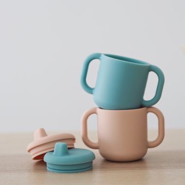 BEABA&reg; 5.8 oz. Silicone Training Cup with Handles. View a larger version of this product image.