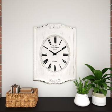 Ridge Road Décor 22-Inch x 31-Inch Farmhouse Wood Wall Clock in White. View a larger version of this product image.