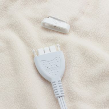 Brookstone&reg; Heated Microfleece Twin Blanket in Cream. View a larger version of this product image.