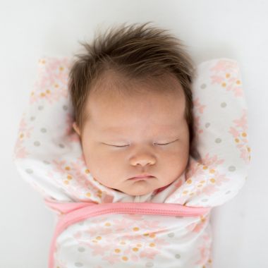 Swaddle Designs Size 0-3M Floral Arms Up Half-Length Sleeves Omni Swaddle Sack in Pink. View a larger version of this product image.