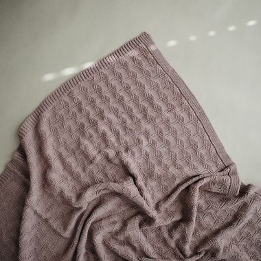 Mushie Knitted Honeycomb Baby Blanket in Desert Rose. View a larger version of this product image.