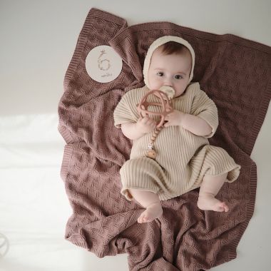 Mushie Knitted Honeycomb Baby Blanket in Desert Rose. View a larger version of this product image.