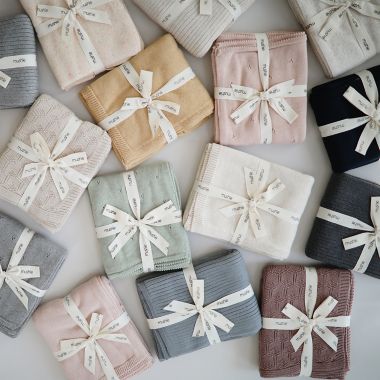 Mushie Knitted Honeycomb Baby Blanket in Desert Rose. View a larger version of this product image.