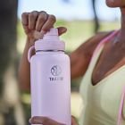 Alternate image 4 for Takeya&reg; Actives 40 oz. Insulated Stainless Steel Water Bottle with Spout Lid in Onyx