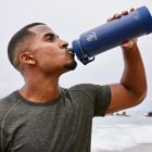 Alternate image 6 for Takeya&reg; Actives 40 oz. Insulated Stainless Steel Water Bottle with Spout Lid in Onyx