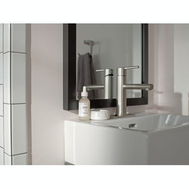 Moen&reg; Arlys Wall Mount Toilet Paper Holder in Brushed Nickel. View a larger version of this product image.