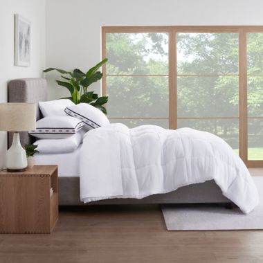 UGG&reg; Devon Down Alternative Quilted King Comforter in White. View a larger version of this product image.