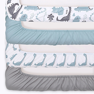 The Peanutshell&trade; 4-Pack Dino Microfiber Crib Fitted Sheets in Blue/White. View a larger version of this product image.
