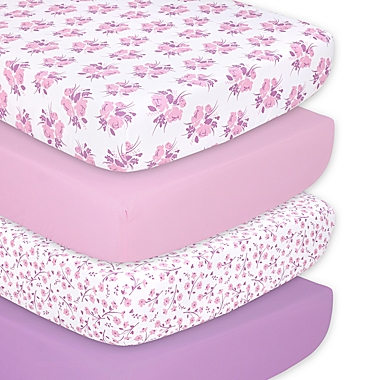 The Peanutshell&trade; 4-Pack Floral Microfiber Fitted Crib Sheets in Purple/Pink. View a larger version of this product image.