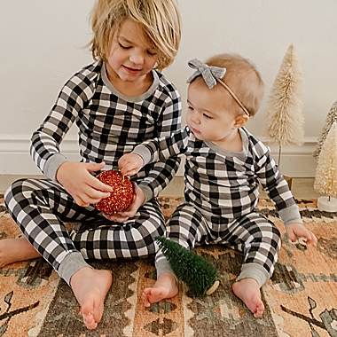 The Honest Company&reg; 2-Piece Buffalo Check Organic Cotton Christmas Pajama Set in Black/White. View a larger version of this product image.