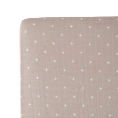 Little Unicorn&reg; Cotton Muslin Fitted Sheet in Cross Taupe. View a larger version of this product image.