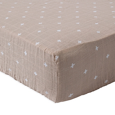 Little Unicorn&reg; Cotton Muslin Fitted Sheet in Cross Taupe. View a larger version of this product image.