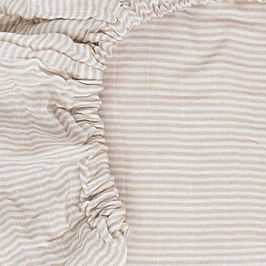 Little Unicorn&reg; Organic Cotton Muslin Crib Sheet in Sand Stripe. View a larger version of this product image.