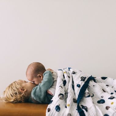 Little Unicorn Planetary Cotton Muslin Quilted Throw. View a larger version of this product image.