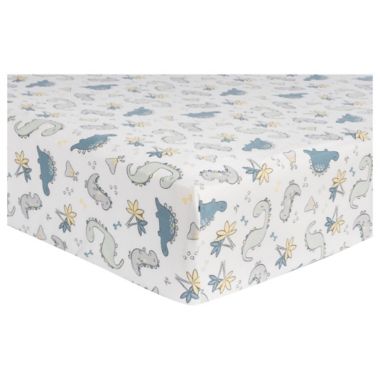 Trend Lab&reg; Little Dinos Deluxe Flannel Fitted Crib Sheet in White/Multi. View a larger version of this product image.