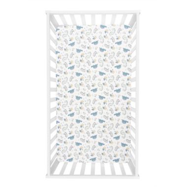 Trend Lab&reg; Little Dinos Deluxe Flannel Fitted Crib Sheet in White/Multi. View a larger version of this product image.