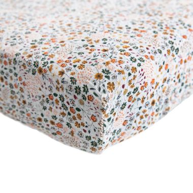 Little Unicorn&reg; Cotton Muslin Fitted Sheet in Pressed Petals. View a larger version of this product image.