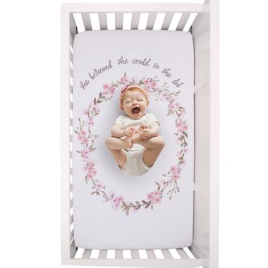 ever & ever&trade; Flower Fairy Photo-OP Fitted Crib Sheet in Pink. View a larger version of this product image.