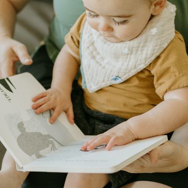 Little Unicorn&reg; 2-Pack Cross Reversible Bandana Bibs in Taupe. View a larger version of this product image.