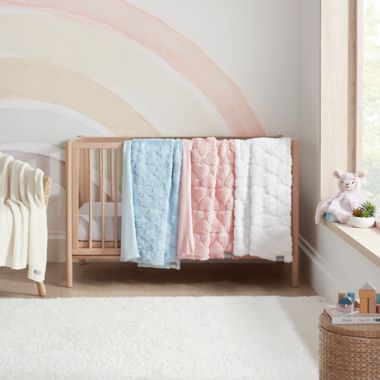 UGG&reg; Polar Carved Faux Fur Throw Blanket in Pink Hearts. View a larger version of this product image.