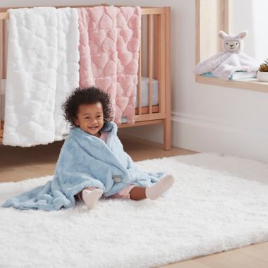 UGG&reg; Polar Carved Faux Fur Throw Blanket in Pink Hearts. View a larger version of this product image.