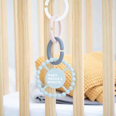 Bella Tunno&trade; "Baby Needs a Minute" Happy Teether in Green. View a larger version of this product image.