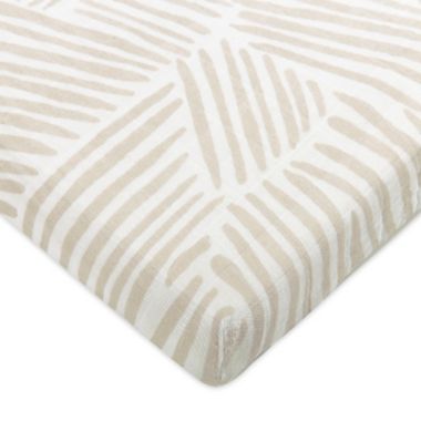 Babyletto Oat Stripe Muslin Midi Crib Sheet in Beige. View a larger version of this product image.
