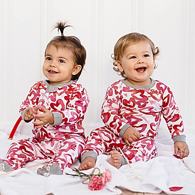 Burt&#39;s Bees Baby&reg; Size 0-3M Love Hearts Sleep &amp; Play Footed Pajamas in Rose. View a larger version of this product image.