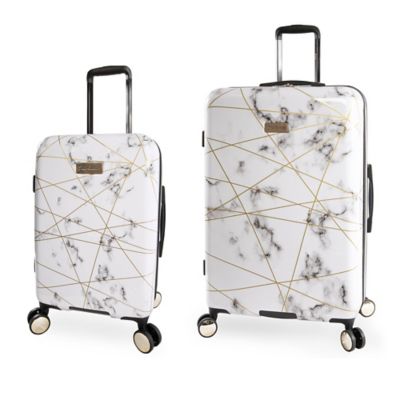 white hardside luggage