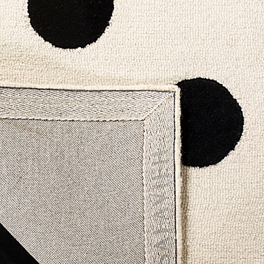 Safavieh Kids&reg; Dots 3&#39; x 5&#39; Rug in Black. View a larger version of this product image.
