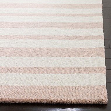 Safavieh Kids Stripe Area Rug in Pink/Ivory. View a larger version of this product image.