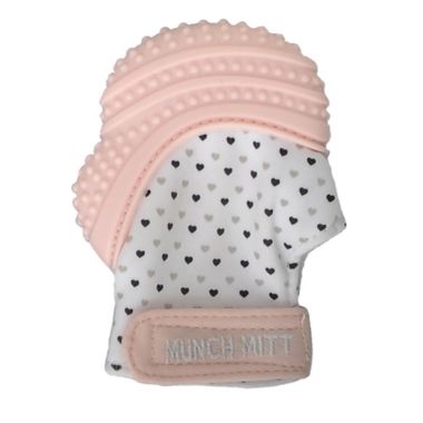 Munch Baby Munch Mitt Teething Mitten in Pastel Pink. View a larger version of this product image.