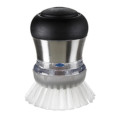 OXO SteeL&trade; Soap Squirting Palm Brush. View a larger version of this product image.