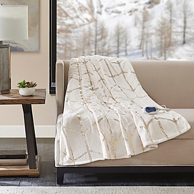 True North by Sleep Philosophy Raina Heated Metallic Throw Blanket in Ivory. View a larger version of this product image.