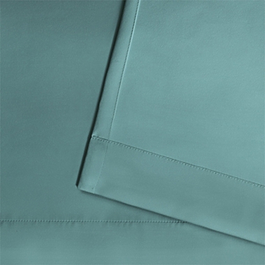 Solid Indoor/Outdoor 84-Inch Grommet Window Curtain Panels in Teal (Set of 2). View a larger version of this product image.