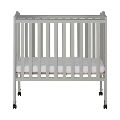 dream on me mini crib mattress size