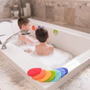 Innobaby 7-Pack Bathin' Smart Rainbow Spots Silicone Bath Toy and Scrub Set. View a larger version of this product image.
