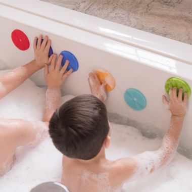 Innobaby 7-Pack Bathin' Smart Rainbow Spots Silicone Bath Toy and Scrub Set. View a larger version of this product image.