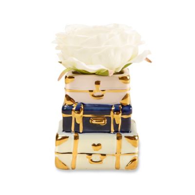 white and gold suitcase