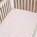 Alternate image 1 for Just Born&reg; One World&trade; Collection Blossom Polka Dot Fitted Sheet in Pink/White